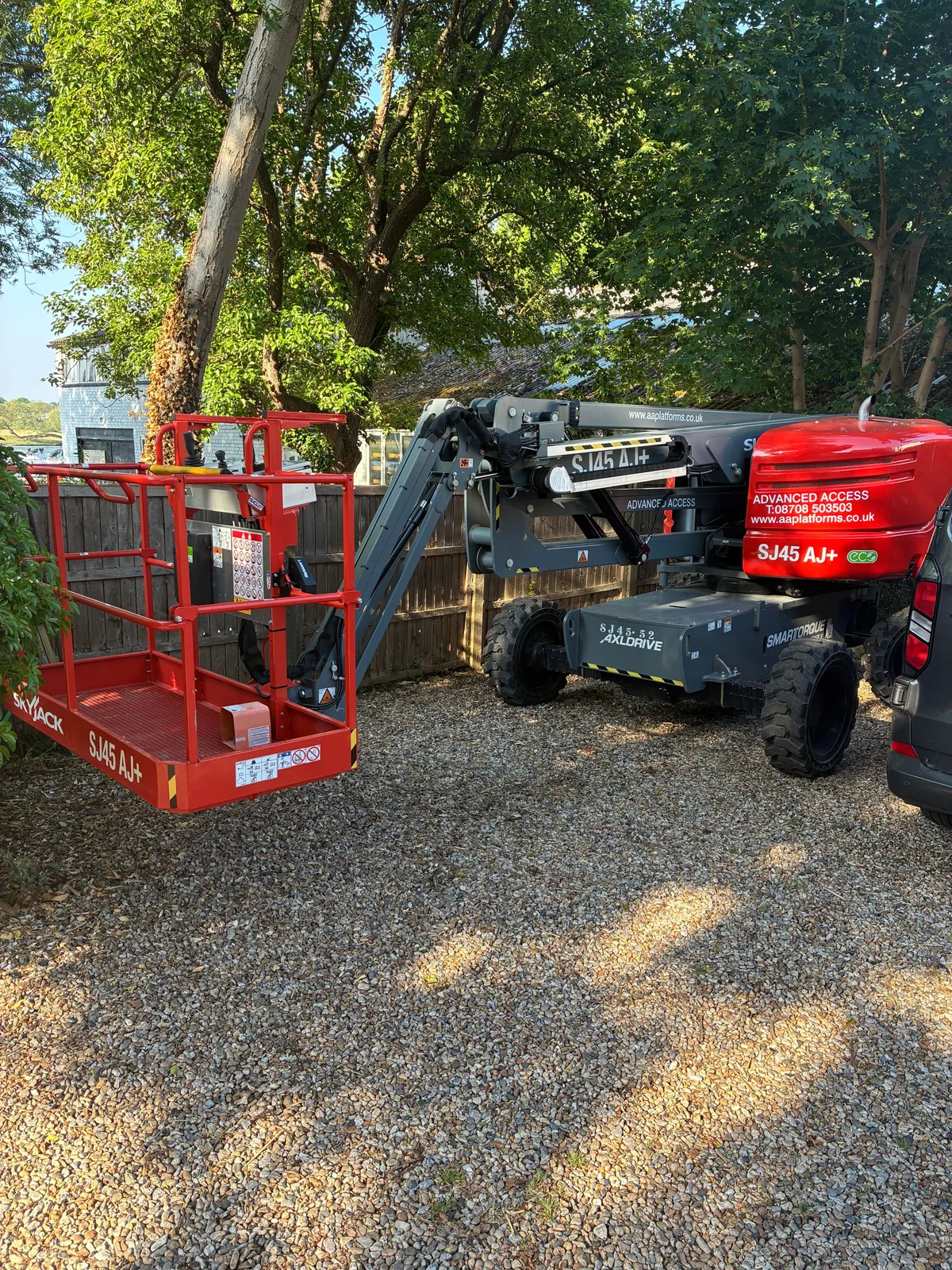 Advanced Access Skyjack cherry picker set up on site by the Thames at Hampton